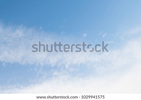 blue sky background with white cirrus clouds