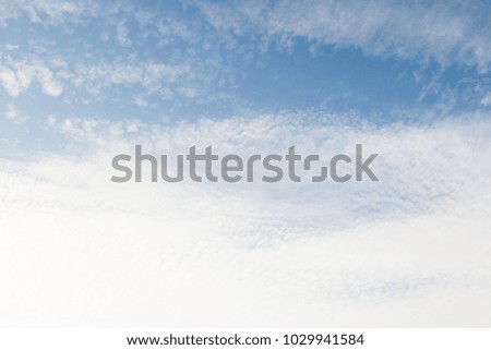 blue sky background with white cirrus clouds
