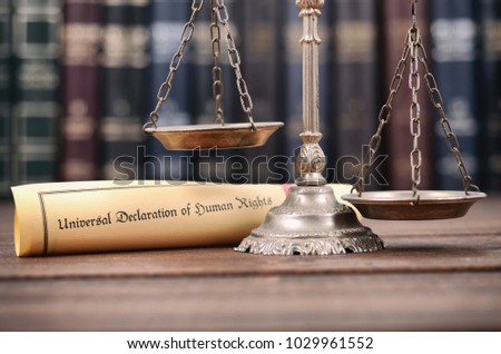 Law and Justice, Scales of Justice, Universal declaration of human rights on a wooden background, human rights concept.