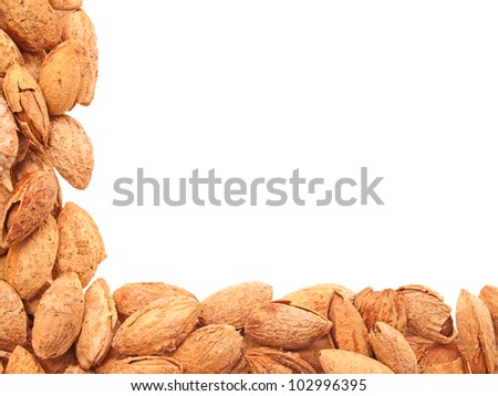 Almonds in shell laid out at right angles. Isolated on white.