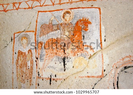 Saint George killing the dragon. Interior of a cave church with early Christian Byzantine fresco - Cappadocia, Central Anatolia, Turkey 