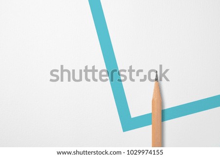 Minimalist template with copy space by top view close up photo of wooden pencil isolated on white paper and combination with blue green line shape graphic. Flash light made smooth shadow from pencil.