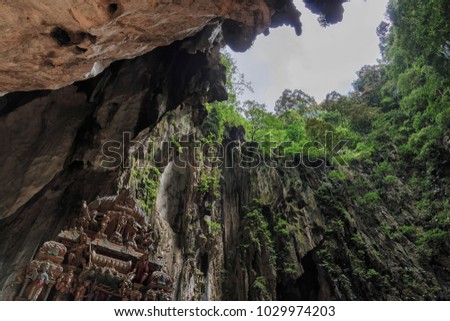 Temple inside the Batu Caves in Kuala Lumpur, Malaysia. Batu Caves are located just north of Kuala Lumpur,and have three main caves featuring temples and Hindu shrines.
