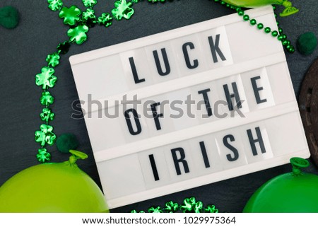 Luck of the irish message on a lightbox with St Patrick's decorations