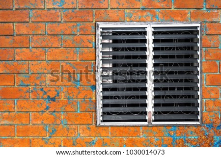 Old louvers with brick wall