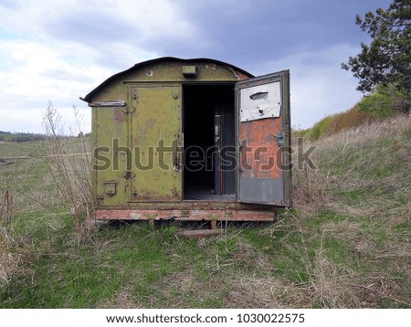 Open old army caravan on to the meadow