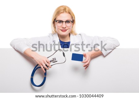 Woman doctor with stethoscope and business card