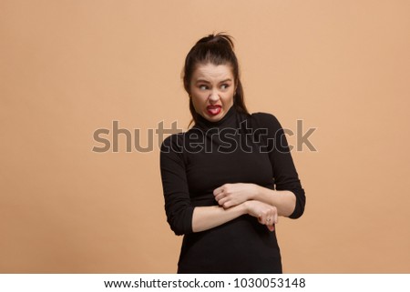 Ew. It's so gross. Young woman with disgusted expression repulsing something. Disgust concept. Young emotional woman. Human emotions, facial expression concept. Studio. Isolated on trendy pastel color