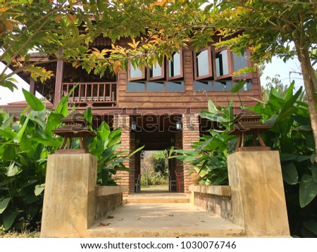 The entrance door to the Thai house
 Royalty-Free Stock Photo #1030076746
