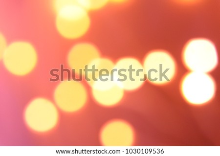 Blurred bokeh of orange and yellow glittering shine bulb light with background that can paste some text on the photo.