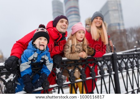Picture of parents with children on winter walk