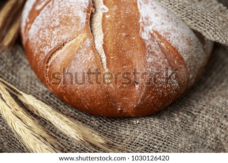 Fresh bread on table. Homemade bread. Kitchen or bakery poster design. Bread background