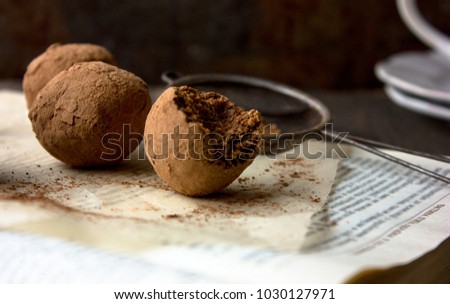 A beautiful picture of A round potato cake one on a book ,darck background. cake pops