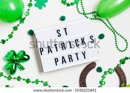 St Patrick's day party lightbox message with green decorations