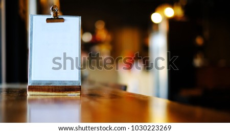 Mock up Menu frame on Table in Bar restaurant cafe