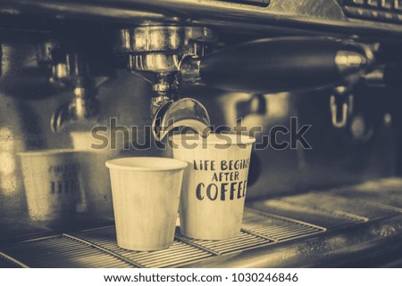 Coffee machine and capkake in the cafe
