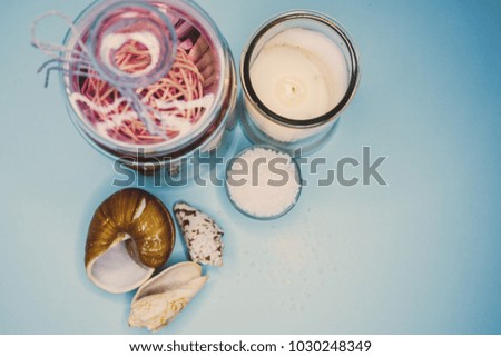 Background on the topic of spa shells candle and salt