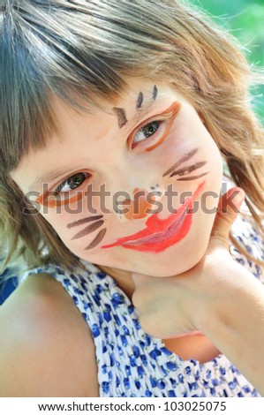 happy smiling child with funny painted face