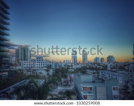 The skyline of Miami, Florida as seen from Miami Beach at sunset.