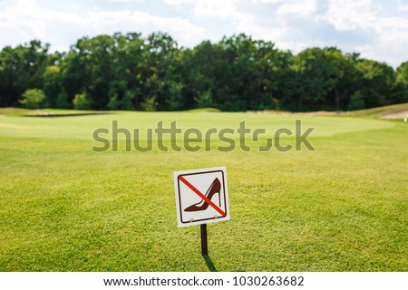 Don't walk on the grass sign. Sign board on the park lawn Do not walk on the Grass.