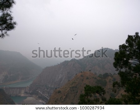 Eagles flying over a lovely dam. Photo of Salal dam in Jammu and Kashmir