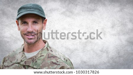 Digital composite of Soldier against white wall with grunge overlay