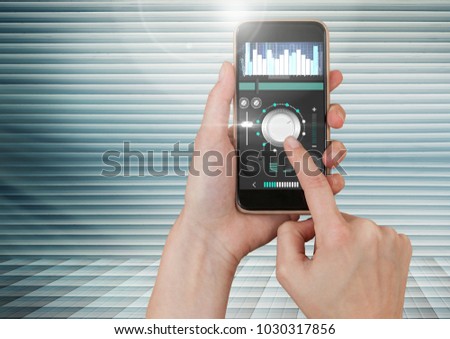Digital composite of Hand Touching Mobile phone with Sound Music and Audio production engineering equalizer App Interface