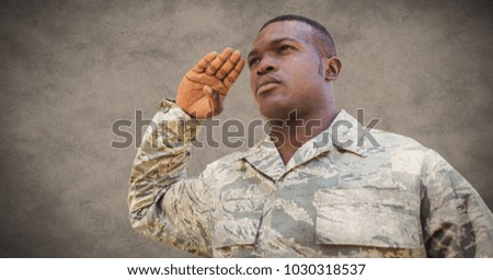 Digital composite of Soldier saluting against brown background with grunge overlay