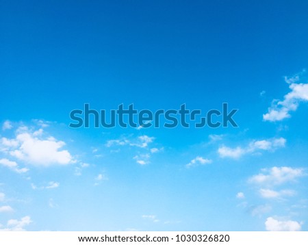 Blurred blue sky and white clouds with space for your text and design.Concept be used for freedom of think and life,growth of business,desktop,book,card,relax time on summer and refresh your body.