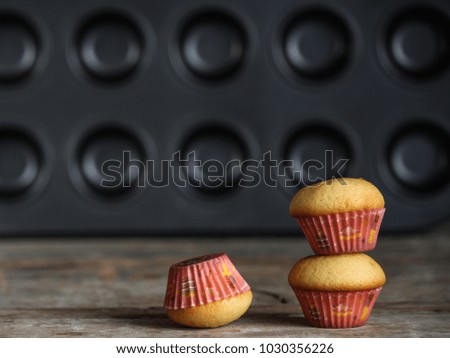 muffins (cupcakes) - fresh pastries on a wooden surface. copy space