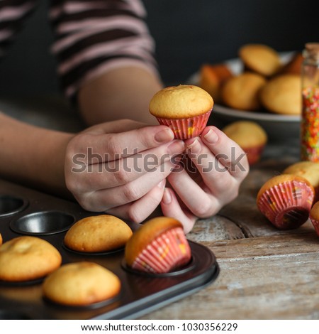 muffins (cupcakes) - fresh pastries on a wooden surface. copy space