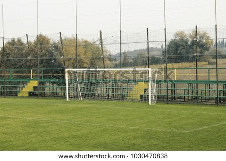 Soccer field with goal posts and light poles