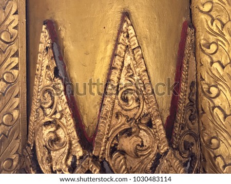 Golden craft stucco decoration in Buddhist temple, handmade floral pattern decor
