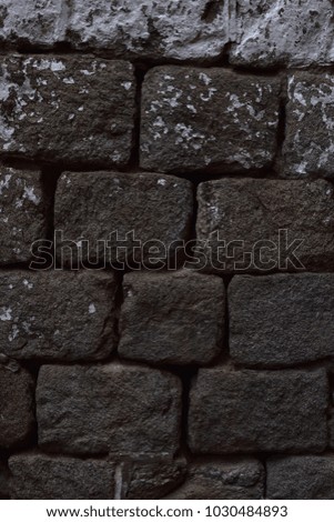 Closeup aged cobblestone abstract background texture. 