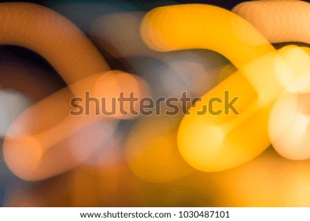background with blurry yellow lights of lanterns at night