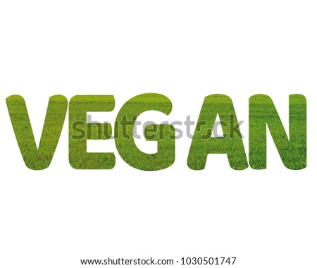 Isolated word VEGAN with grass and white background