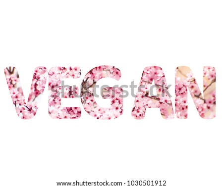 Isolated word VEGAN with pink flowers and white background