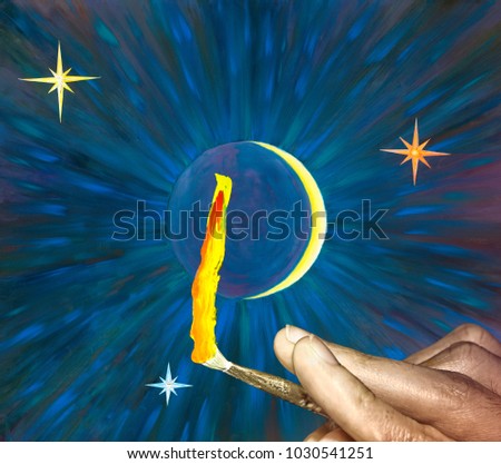 Working brush is in the hand of artist with oil paints stroke looks like flame. View on the back side. Closeup on oil painting background night sky, 
young moon, stars and beams.