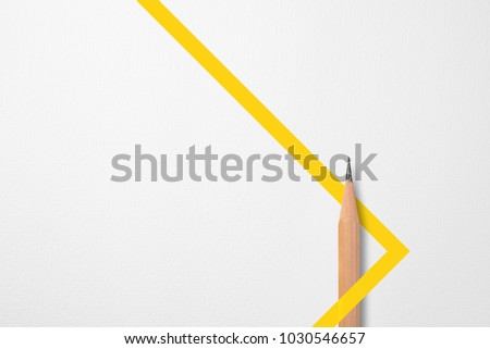 Minimalist template with copy space by top view close up photo of wooden pencil isolated on white paper and combination with yellow line shape graphic. Flash light made smooth shadow from pencil. Royalty-Free Stock Photo #1030546657
