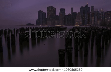 Live the moment. Foggy Manhattan downtown skyline view during sunrise.  