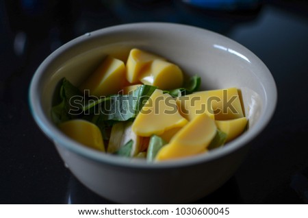 Low exposure photo of egg tofu with vegetable in a bowl