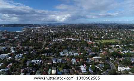 Aerial view of North Curl Curl beach, Sydney. View of the coast and nearby houses and parks 