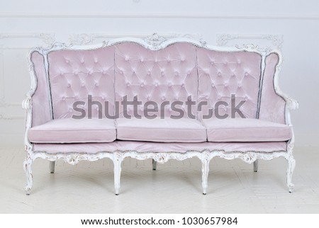 Vintage royal sofa in a room, white wall