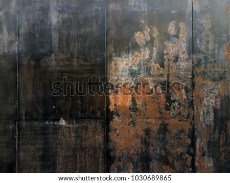 Dark worn rusty metal texture background. Multicolor grunge background. Spots of colored paint. The multicolored grunge texture for design