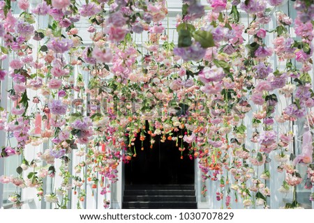 Artificial Flowers Hanging from Ceiling Royalty-Free Stock Photo #1030707829