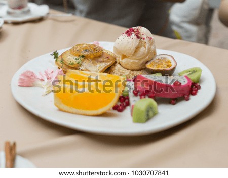 Pancakes Served with Colorful Tropical Fruit