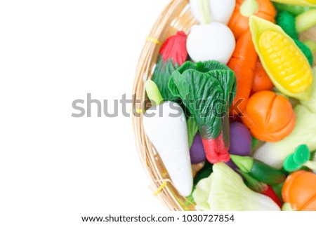 Vegetable handmade from plasticine clay placed on white background