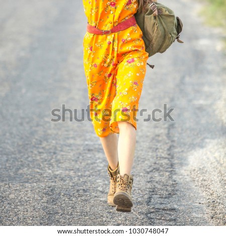 Travel legs  walking on the road, vacation trip concept