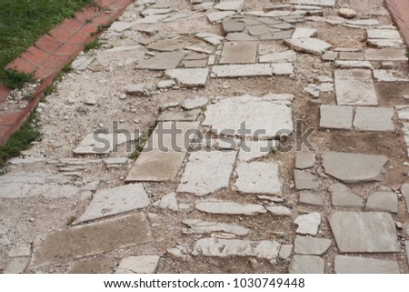 road with tiles which need repair, background, texture