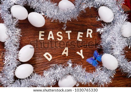 Happy Easter Day concept. Cartoon rabbit with eggs and butterfly on wooden, free space for text.